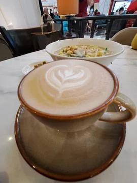 A Cup of Caffe Latte with Heart Latte Art Served with Scrambled Egg Instant Nood Stock Photos