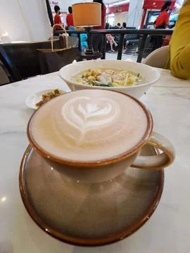 A Cup of Caffe Latte with Heart Latte Art Served with Scrambled Egg Instant Nood Stock Photos