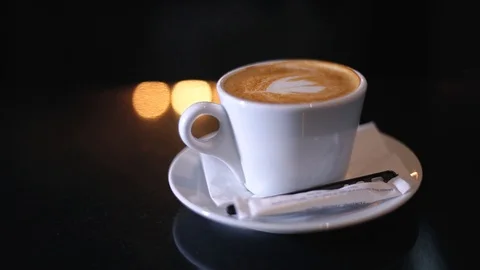 Cup Of Cappuccino On a Black Surface Stock Footage 103488561