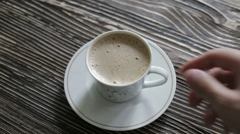 A cup of cappuccino with foam is on the table Stock Footage 63042981