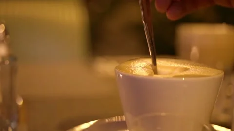 A cup of cappuccino in night cafe Stock Footage 56937771