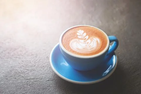 A cup of cappuccino on stone table. Stock Photos