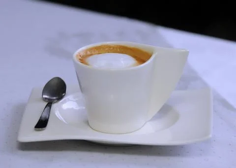 A cup of cappuccino on the table at the bar Foto stock