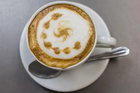 The cup of cappuccino on the table Stock Photos