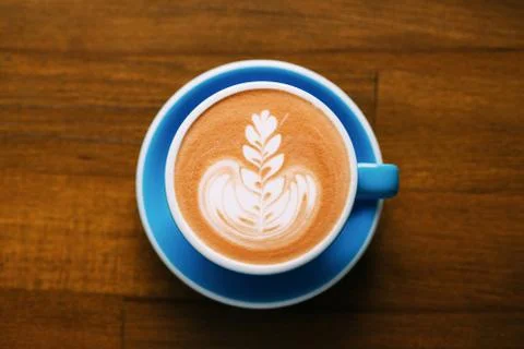 A cup of cappuccino on table. Stock Photos