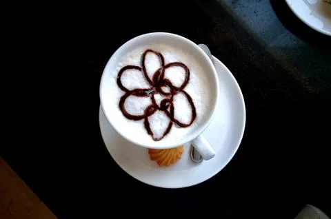 A cup of cappuccino on the table. Stock Photos