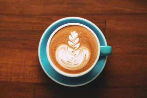 A cup of cappuccino on table. Stock Photos
