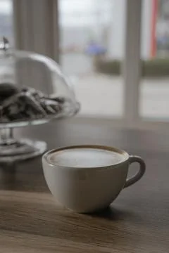 A cup of cappuccino is on the table Stock Photos