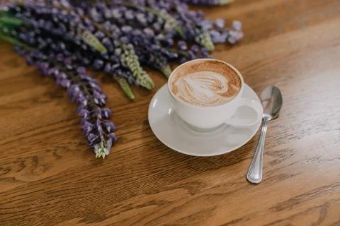 A cup of cappuccino on the table Stock Photos