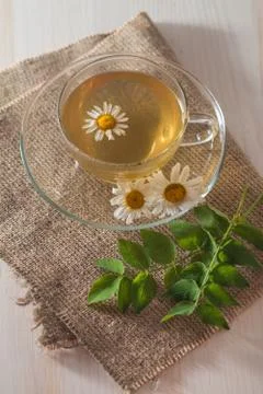 Cup of chamomile tea Stock Photos