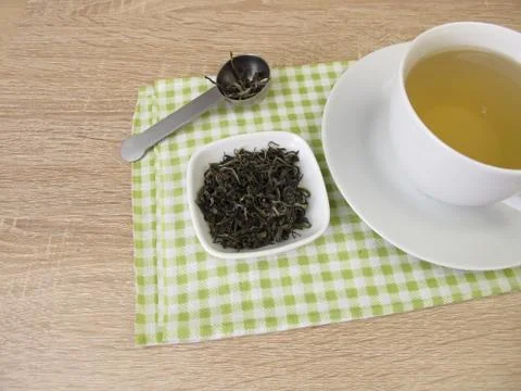 Cup of chinese tea white monkey Stock Photos