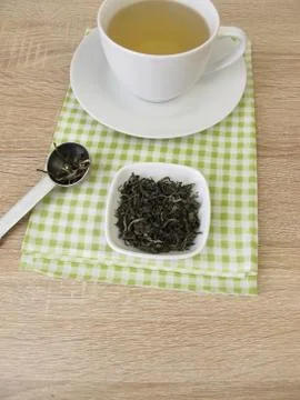 Cup of chinese tea white monkey Stock Photos