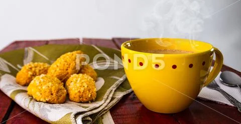 Cup of chocolate with yellow cup and breads Stock Photos
