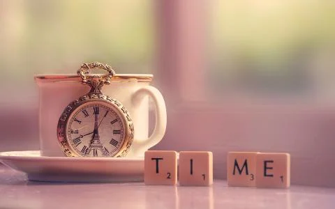 Cup with clock Stock Photos