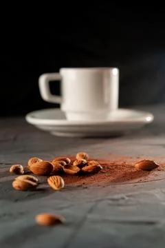 Cup with cocoa beans on a dark background vertical frame Stock Photos