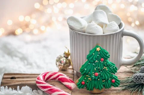 A cup of cocoa with marshmallows close-up on a blurred background. Stock Photos