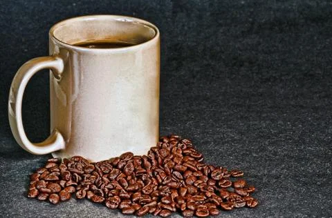 Cup Of Coffee And Beans Stock Photos