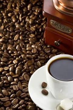 Cup of coffee and beans Stock Photos