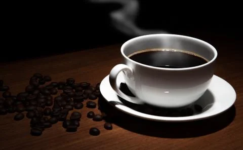 Cup of coffee and beans on the table Foto stock