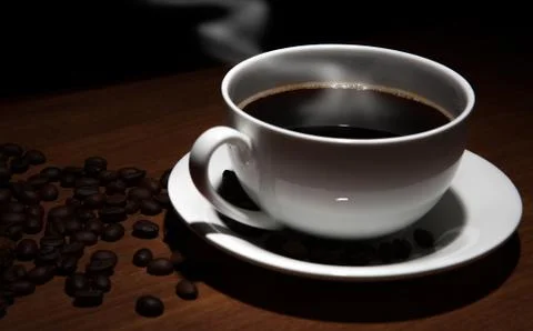 Cup of coffee and beans on the table Stock Photos