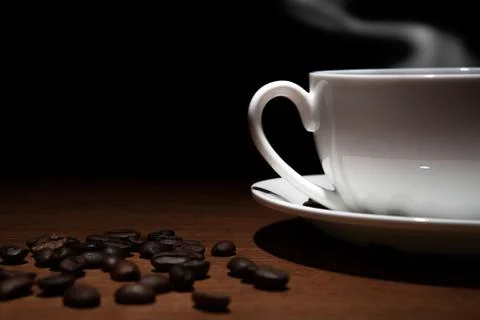 Cup of coffee and beans on the table Foto stock