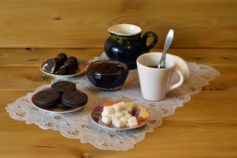 A cup of coffee and biscuits Stock Photos
