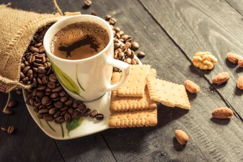Cup of coffee and biscuits Stock Photos