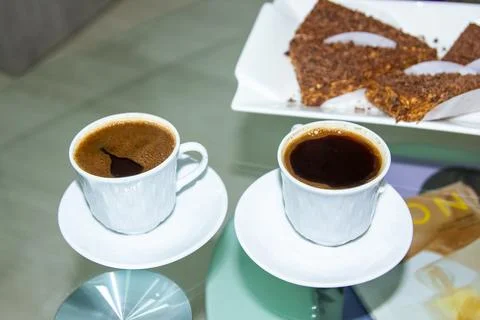 Cup of coffee and cake on the table Stock Photos