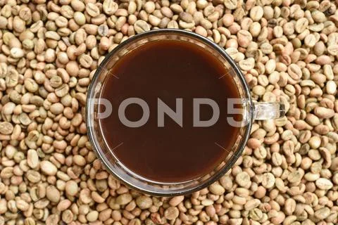 Cup of coffee and coffee beans Stock Photos