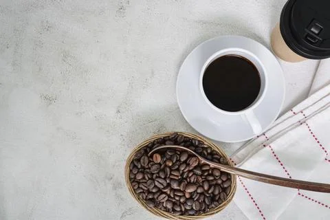 Cup of coffee and coffee beans background. Food and beverage concept. Stock Photos