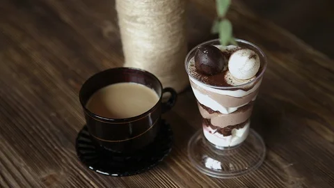 A cup of coffee and dessert is on the table Video stock 87862234