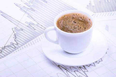 Cup of coffee and graphs Stock Photos