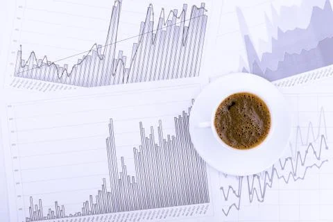 Cup of coffee and graphs Stock-Fotos