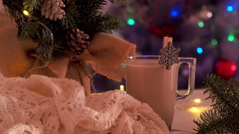 Cup of coffee  and the knitted shawl on background Christmas Tree Stock Footage 237012002
