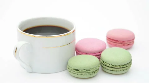 Cup of coffee and macaroons sliding in Stock Footage 46031074