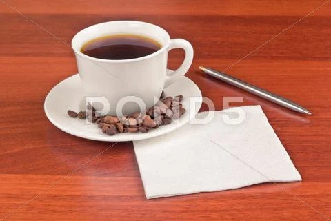 Cup of coffee and napkin Stock Photos