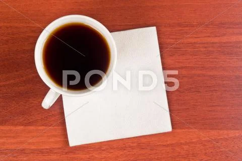 Cup of coffee and napkin Stock Photos