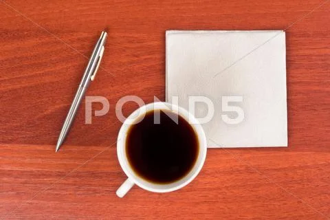 Cup of coffee and napkin Stock Photos