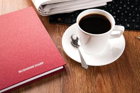 Cup of coffee and the newspaper Stock Photos