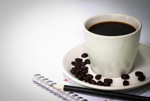 Cup of coffee and  notebook. Stock Photos