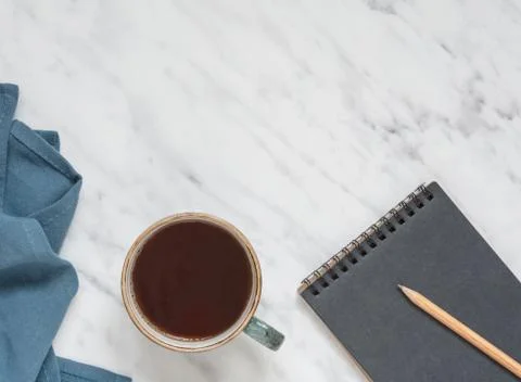 Cup of coffee and notebook Stock-Fotos