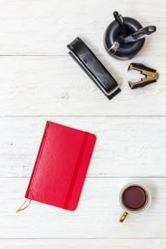 Cup coffee and notepad on white boards Stock-Fotos