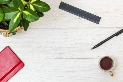 Cup coffee and notepad on white boards Stock Photos