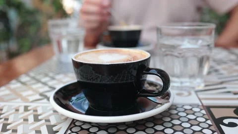 Cup of Coffee and one in background Stock Footage 220522130