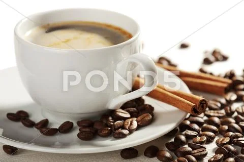 Cup of coffee and roasted beans isolated Stock Photos