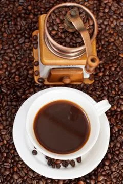 Cup of coffee and roasted beans Stock Photos