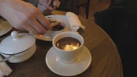 Cup of coffee and a slice of cherry cake Stock-Footage 76153172