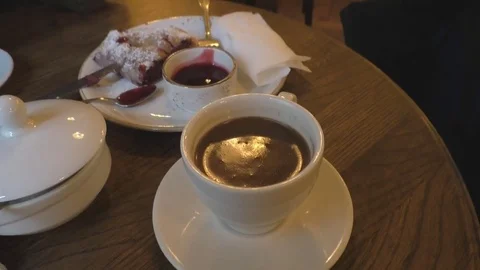 Cup of coffee and a slice of cherry cake Stock-Footage 85068541