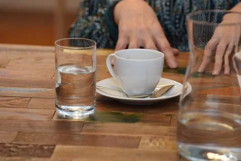 A cup of coffee and tableware Stock Photos