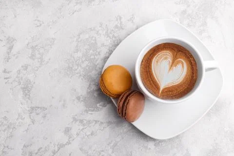 Cup of coffee and two macarons Stock Photos